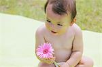 Baby Holding Flower