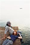 Couple resting on jetty