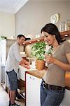 Couple working in kitchen