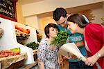 Young people buying fruits and vegetable