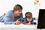 Father and son playing a video game