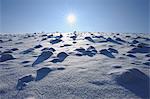 Sun over snow field, Wasserkuppe, Rhon Mountains, Hesse, Germany