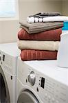 Stack of Clean Towels on Washer and Dryer