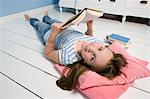 Girl Lying on Floor with Book
