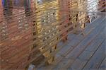 Bryggen Reflecting in Wet Boardwalk, Bergen, Hordaland, Norway