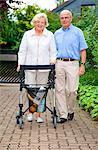 Senior couple with walking frame making purchases