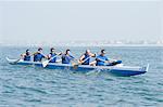 Outrigger canoeing team on water