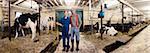 Portrait of Farmers in Barn, Ontario, Canada