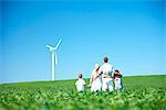 Family looking at wind turbine