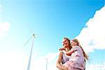 Mother and daughter at wind turbine