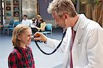 Doctor and patients in waiting area