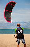 Kitesurfer getting kite ready