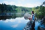 7Y girl sitting by a lake