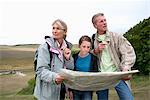 Seniors and granddaughter check map