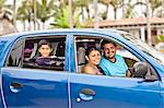 young mexican family in car