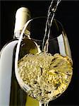 pouring a glass of white wine