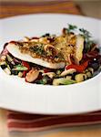 Pan-fried Saint-Pierre fillet and vegetables with almonds and olives