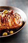 Rolled and roast shoulder of lamb with olives,lemon and pine nuts