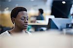 Female office worker at computer