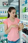 Young woman looking at beauty products in store