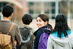 Teenage girl walking with classmates