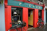 Moate, County Westmeath, Republic Of Ireland; Two Bicycles Parked In Front Of A Store