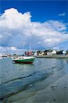 Skerries Harbour, County Dublin, Ireland; Boat Near Shore Of Coastal Village