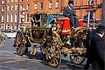 Dublin, Ireland; A Horse Drawn Carriage Going Down O'connell Street