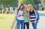 Group of Friends with Cell Phone Going to School