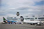 View of several Alaska Airlines commercial jets parked at the Ted Stevens International Airport, Anchorage, Southcentral Alaska, Summer