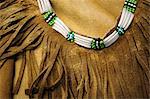 Close up of a Native woman's traditional outfit and necklace, Alaska Native Heritage Center in Southcentral Alaska, Summer/n