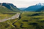 Aerial photo of North Fork Koyukuk River winding away from Frigid Crags and Boreal Mountain, also known as the "Gates of the Arctic," in Gates of the Arctic National Park & Preserve, Arctic Alaska, Summer