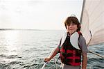 Young boy on board yacht