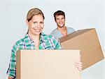 Young couple with cardboard boxes