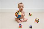 Baby playing with toy blocks