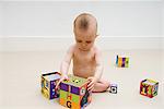 Baby playing with toy blocks