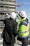 Building contractor and businessman at construction site