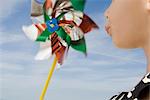 Child blowing pinwheel