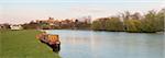 Barged Moored on the Bank of the River Thames, Windsor Castle in the Background, Windsor, Berkshire, England