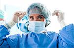 Surgeon wearing surgical mask in operating room