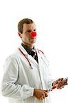 Arzt mit Stethoskop und des Clowns Nase