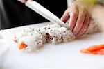 Close-up of Person Making Sushi