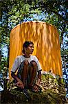 Woman Sitting near Water Tank, Pahola Village, Sumba, Indonesia