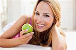 young woman enjoying apple