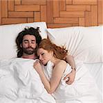 Couple sleeping in bed