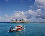 Couple ariving at the Four Seasons Spa in the Maldives, Indian Ocean, Asia