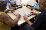 Old men playing dominos on street in Trinidad, Cuba, West Indies, Central America