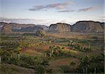 View of Vinales Valley at dawn from grounds of Hotel Los Jasmines showing limestone hills known as Mogotes characteristic of the region, near Vinales, Pinar Del Rio, Cuba, West Indies, Central America