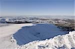 Hikers on snow covered Pen y Fan mountain, Brecon Beacons National Park, Powys, Wales, United Kingdom, Europe