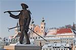 Statue honouring townspeople and Baroque Michaelerkirche church dating from 1635 at sunset, Steyr, Oberosterreich (Upper Austria), Austria, Europe